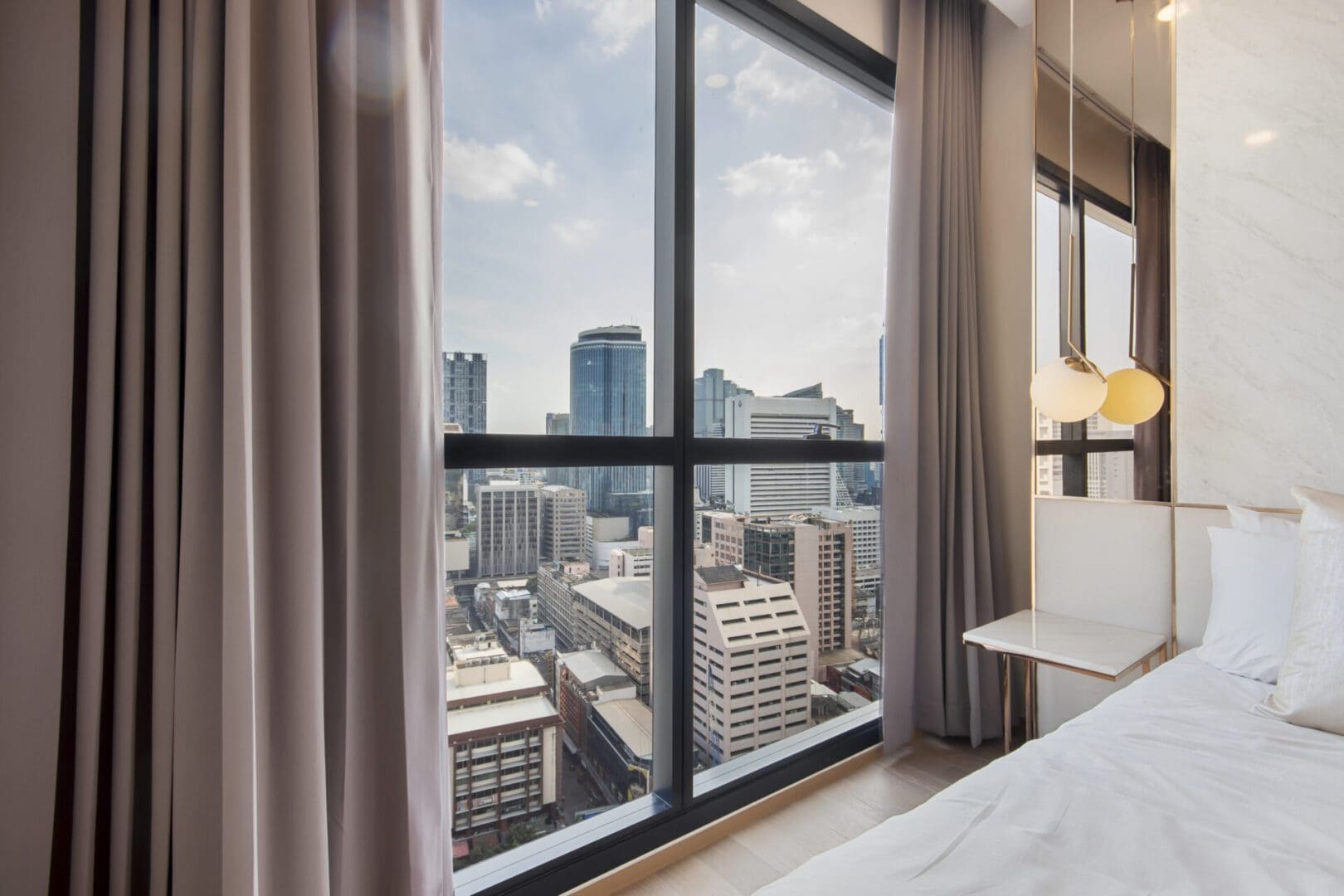 Modern bedroom with city skyline view