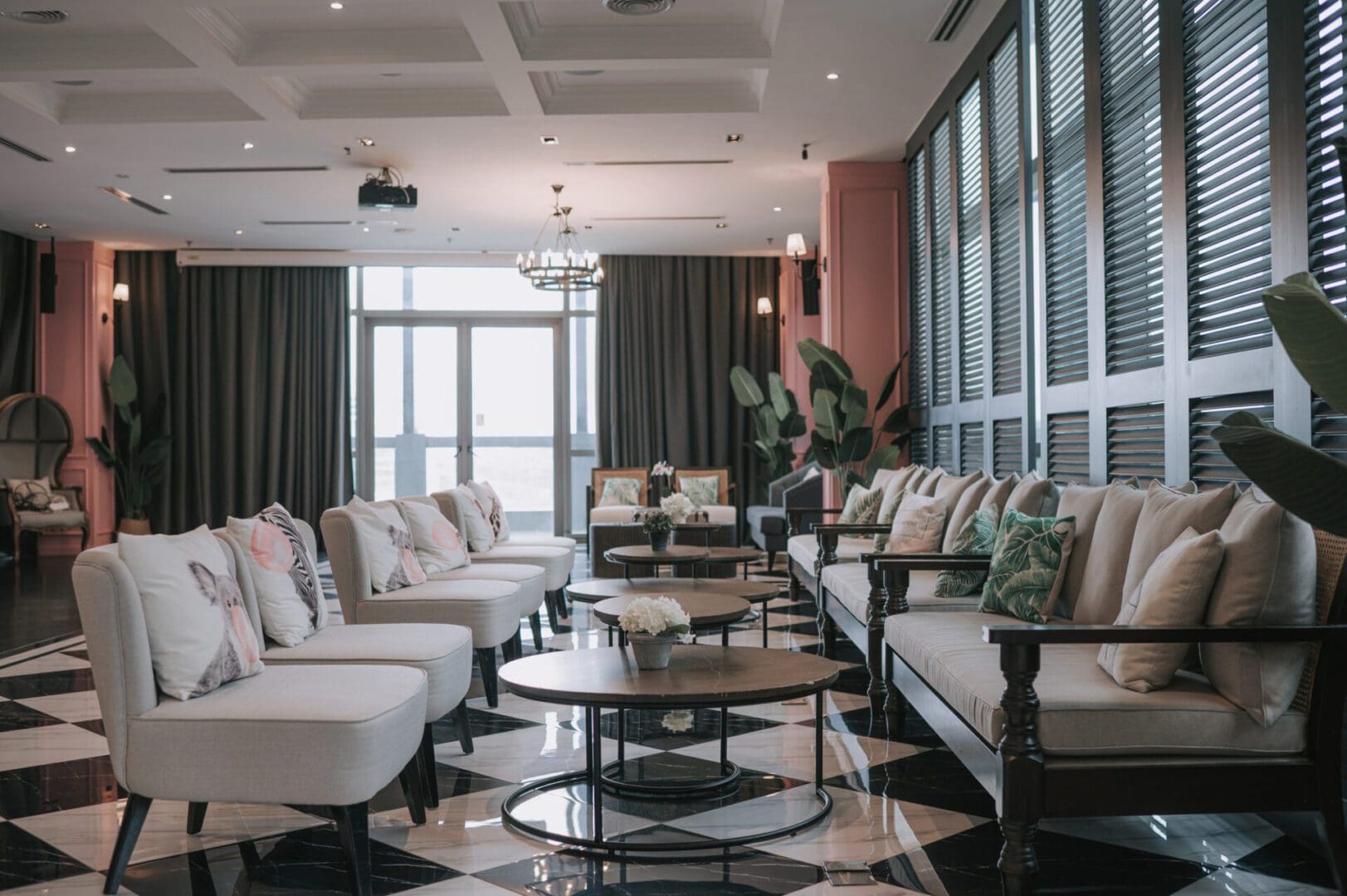 Contemporary hotel lounge with plush seating and plants