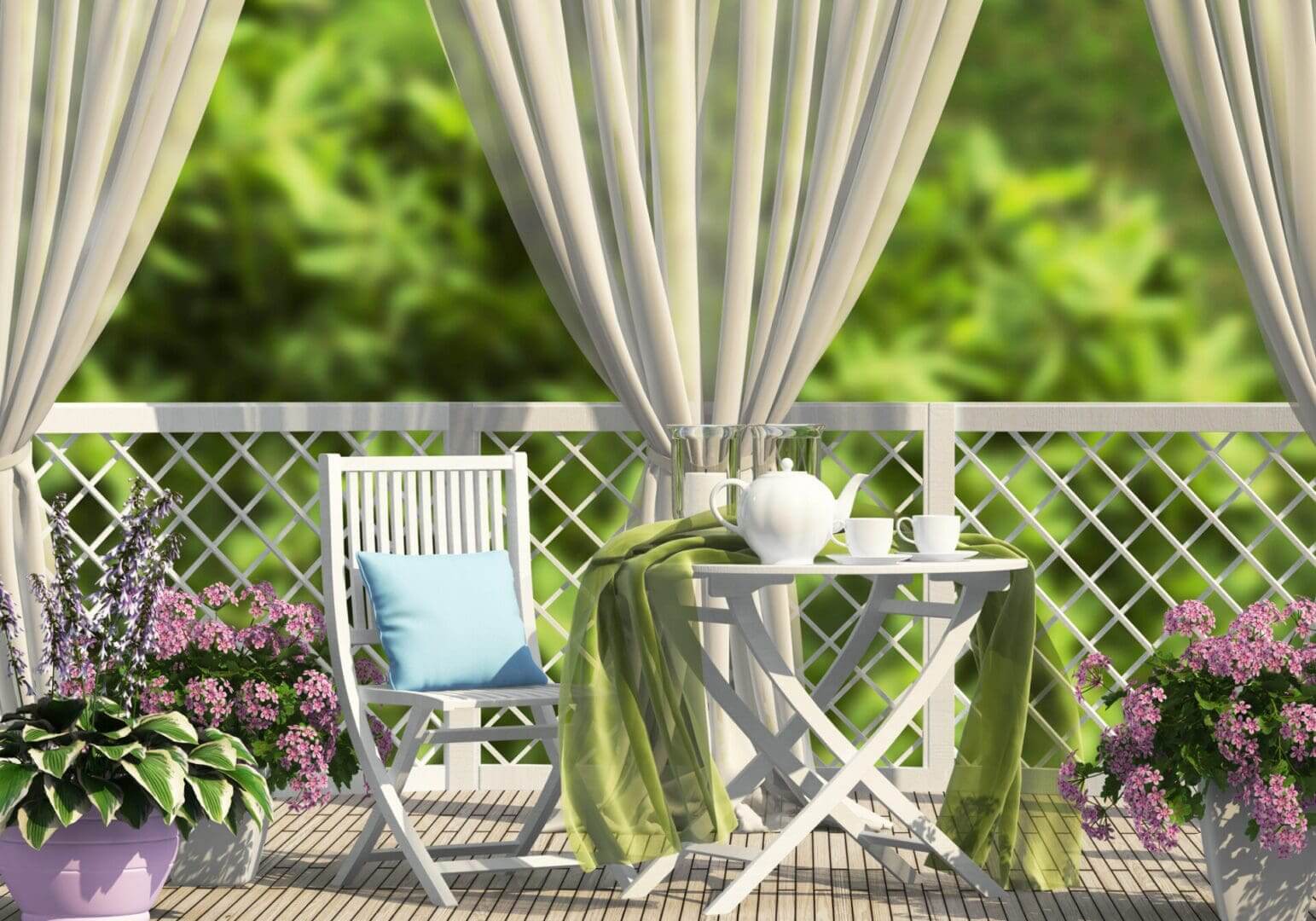 Sunlit balcony seating with tea and flowers