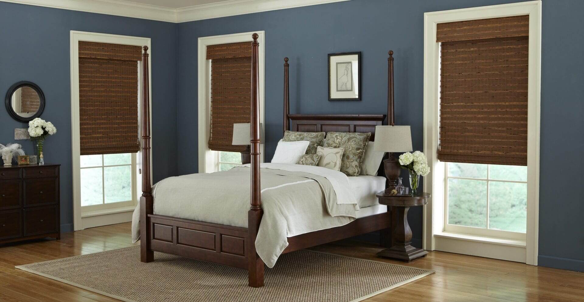 Four-poster bed, blue bedroom with wooden blinds