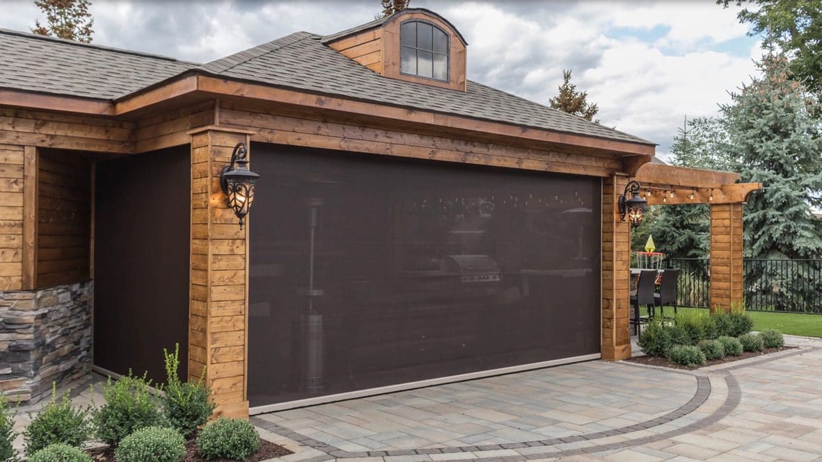 Wooden garage with dark retractable screen door