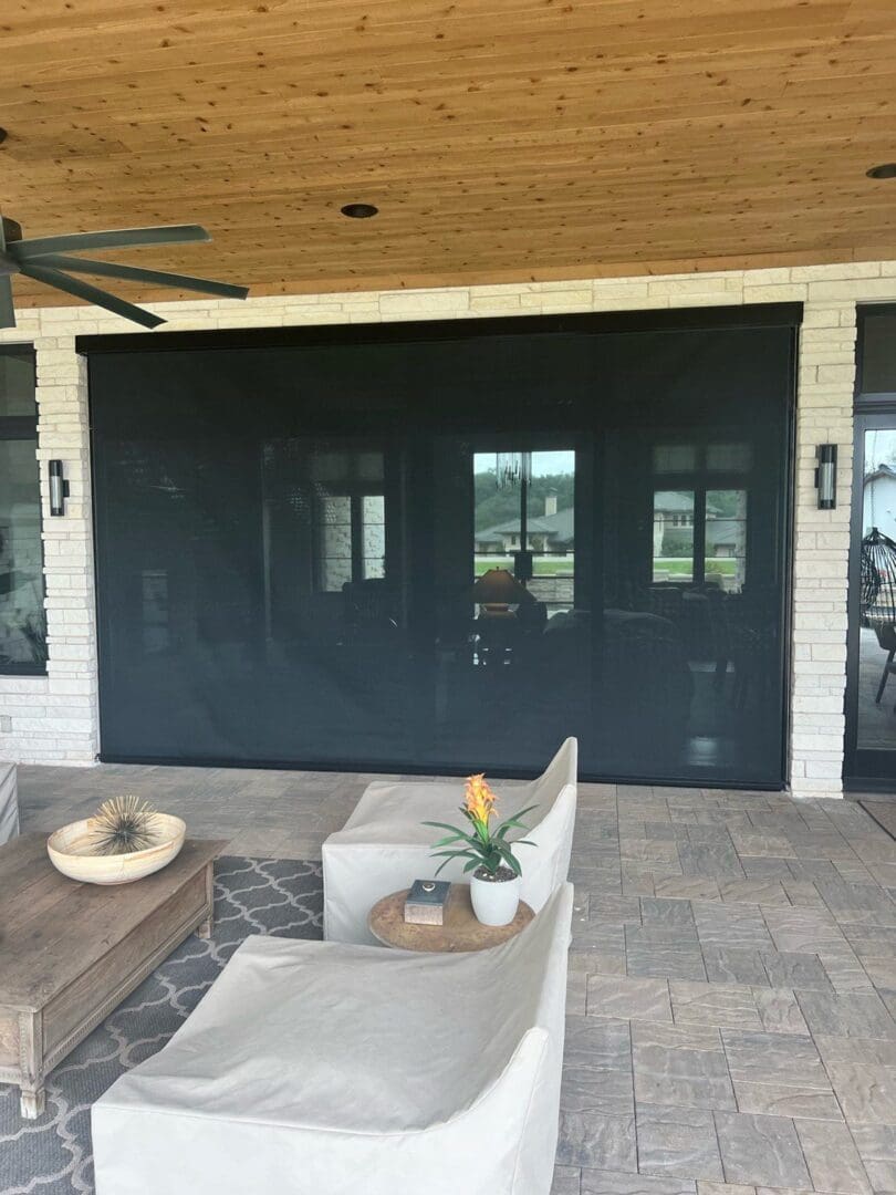 Covered patio with black retractable screen