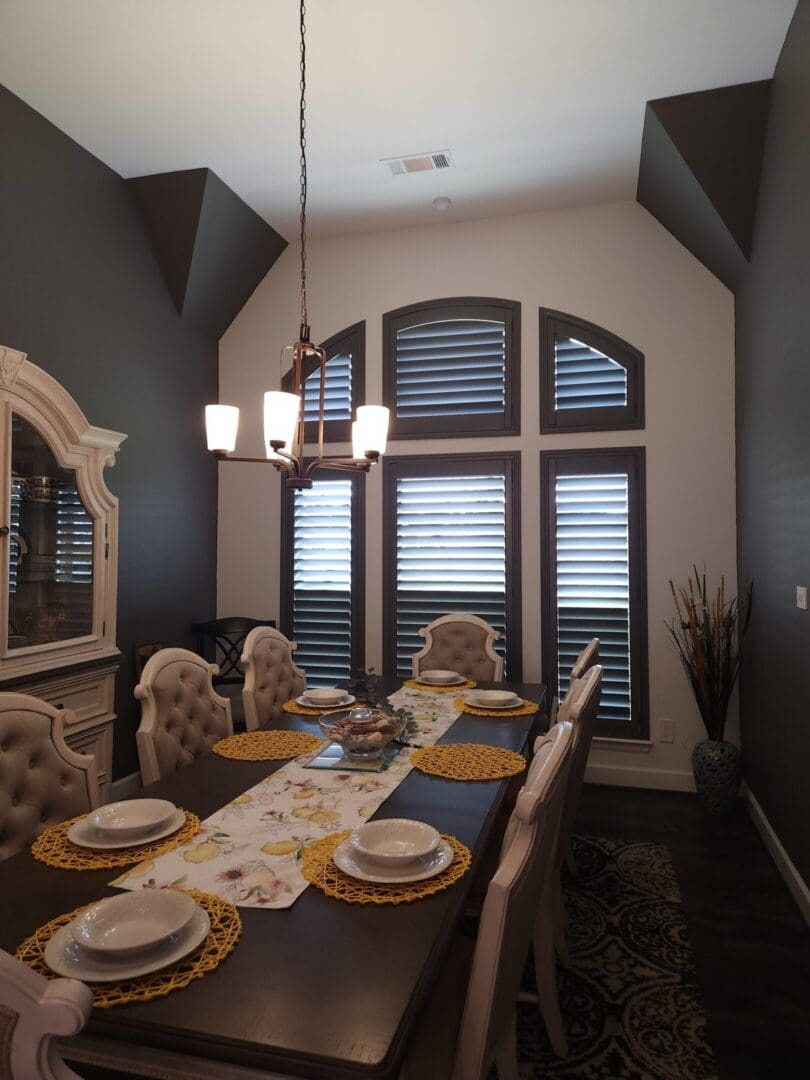 Elegant dining room with arched plantation shutters