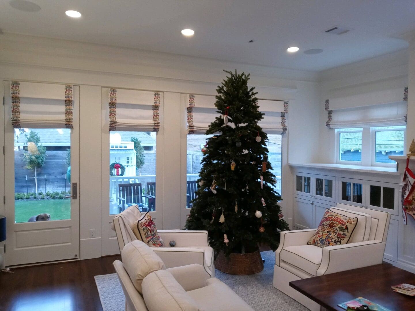 Bright living room with decorated Christmas tree